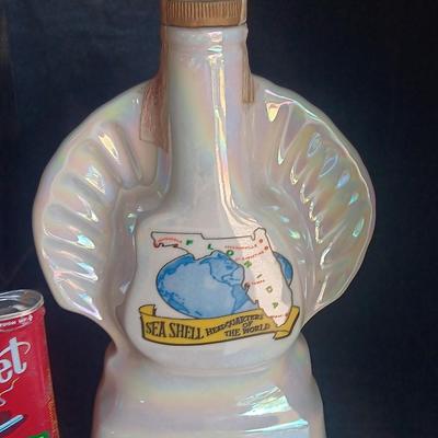 Jim Beam Florida seashell decanter with vintage Velvet tobacco tin