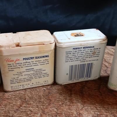 Primitive wooden cutting board with tin spice containers and aluminum salt & pepper shakers