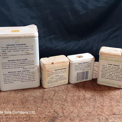 Primitive wooden cutting board with tin spice containers and aluminum salt & pepper shakers