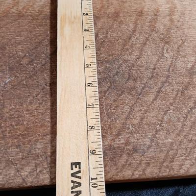 Primitive wooden cutting board with tin spice containers and aluminum salt & pepper shakers