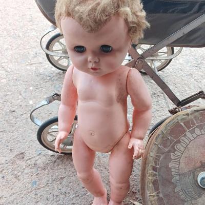 Vintage toy buggy stroller with baby doll and luggage of doll clothes