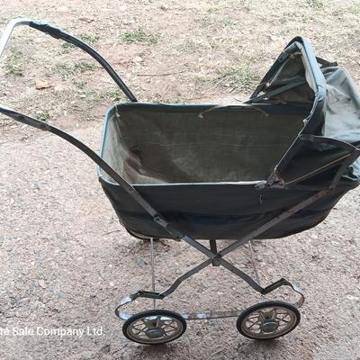 Vintage toy buggy stroller with baby doll and luggage of doll clothes