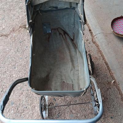 Vintage toy buggy stroller with baby doll and luggage of doll clothes