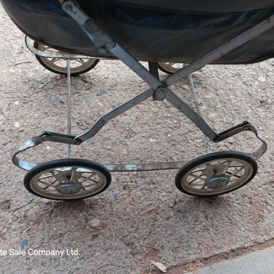 Vintage toy buggy stroller with baby doll and luggage of doll clothes
