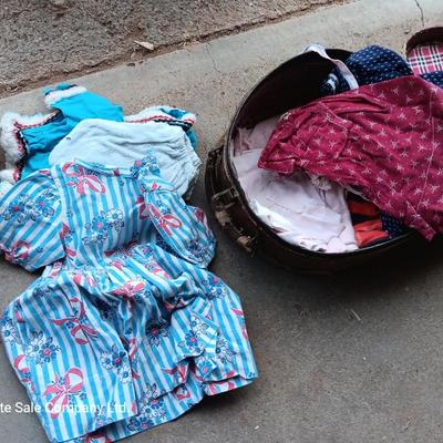 Vintage toy buggy stroller with baby doll and luggage of doll clothes