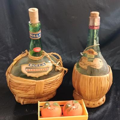 Two wicker covered Italian alcohol bottles with Florida Oranges salt & Pepper shakers