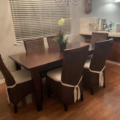 Solid wood dining table and 6 chairs.