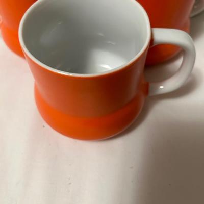 1968 Holt Howard 3 orange coffee mugs and Pyrex cup and saucers.