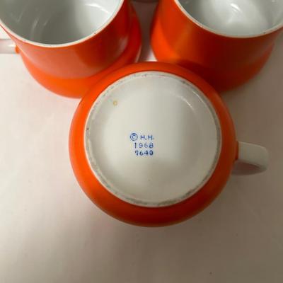 1968 Holt Howard 3 orange coffee mugs and Pyrex cup and saucers.