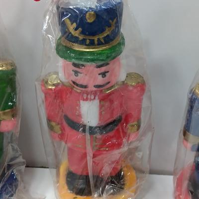 Three Nutcracker Decorative colored candles