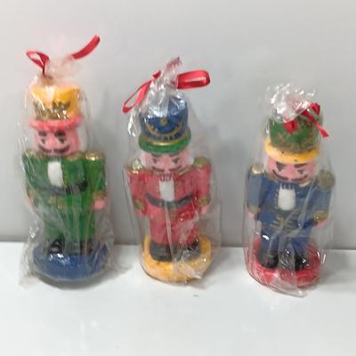 Three Nutcracker Decorative colored candles