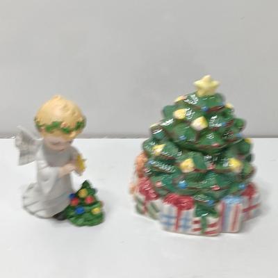 Vintage blonde angel putting star on Christmas tree figurine with tree canister