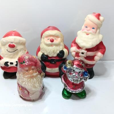 Vintage wax colored candle Santa's with a couple that aren't vintage