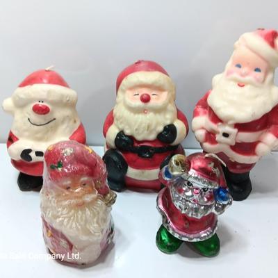 Vintage wax colored candle Santa's with a couple that aren't vintage