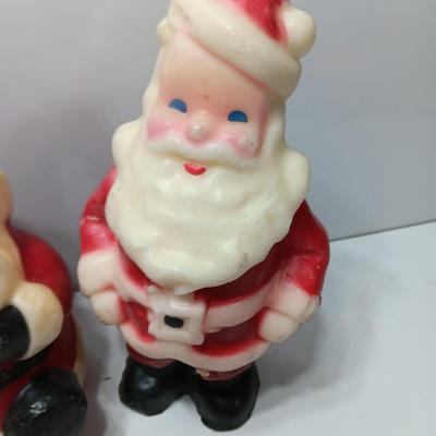 Vintage wax colored candle Santa's with a couple that aren't vintage