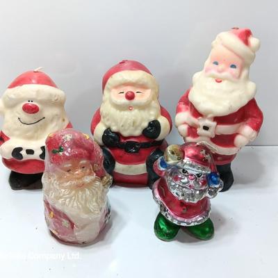 Vintage wax colored candle Santa's with a couple that aren't vintage