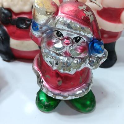 Vintage wax colored candle Santa's with a couple that aren't vintage