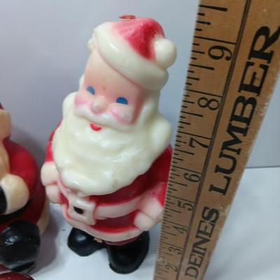 Vintage wax colored candle Santa's with a couple that aren't vintage