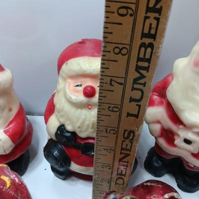 Vintage wax colored candle Santa's with a couple that aren't vintage