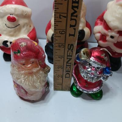 Vintage wax colored candle Santa's with a couple that aren't vintage