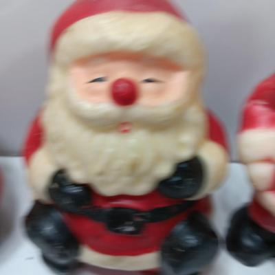 Vintage wax colored candle Santa's with a couple that aren't vintage