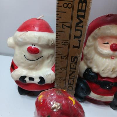 Vintage wax colored candle Santa's with a couple that aren't vintage