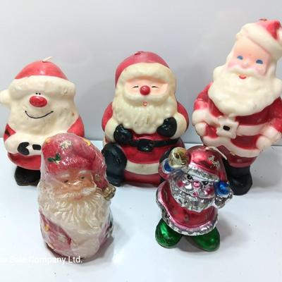 Vintage wax colored candle Santa's with a couple that aren't vintage