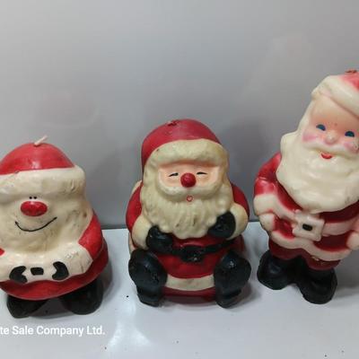 Vintage wax colored candle Santa's with a couple that aren't vintage