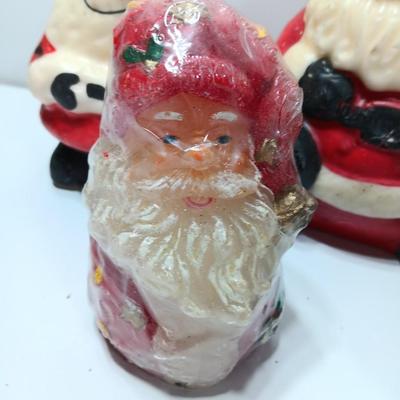 Vintage wax colored candle Santa's with a couple that aren't vintage