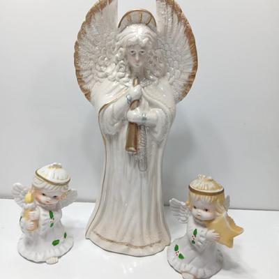 Large angel with glitter wings and two smaller angel figures