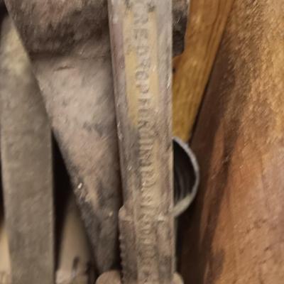 Wooden box with assortment of Antique rusty tools and hardware