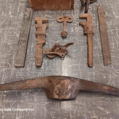 Wooden box with assortment of Antique rusty tools and hardware