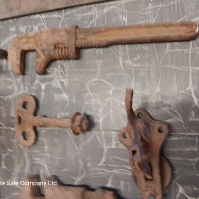 Wooden box with assortment of Antique rusty tools and hardware