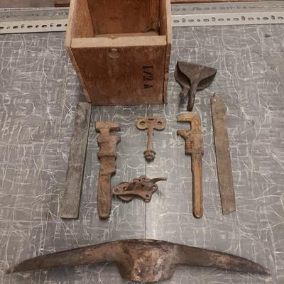 Wooden box with assortment of Antique rusty tools and hardware