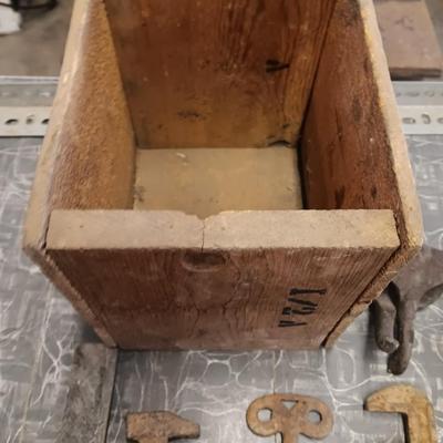 Wooden box with assortment of Antique rusty tools and hardware