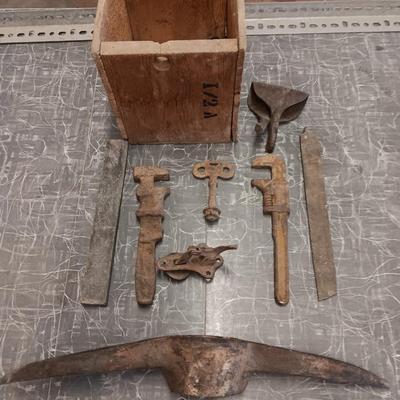 Wooden box with assortment of Antique rusty tools and hardware
