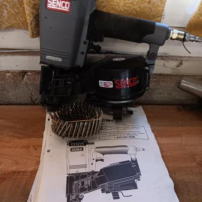 Senco Fastening systems SCN40R coil roofing Nailer with partial box of nails