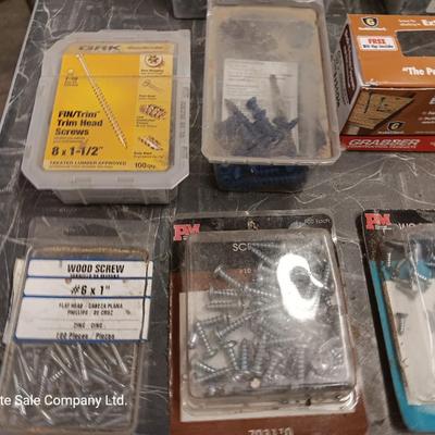 Assortment of hardware still in the boxes / tubs