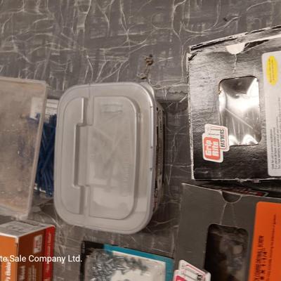 Assortment of hardware still in the boxes / tubs