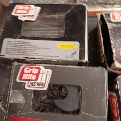 Assortment of hardware still in the boxes / tubs