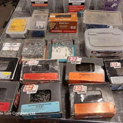 Assortment of hardware still in the boxes / tubs