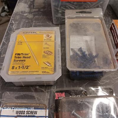 Assortment of hardware still in the boxes / tubs