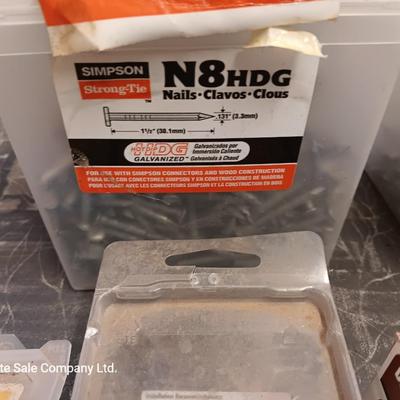 Assortment of hardware still in the boxes / tubs