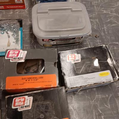 Assortment of hardware still in the boxes / tubs