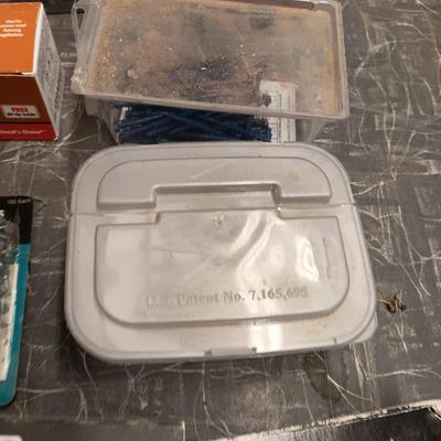 Assortment of hardware still in the boxes / tubs