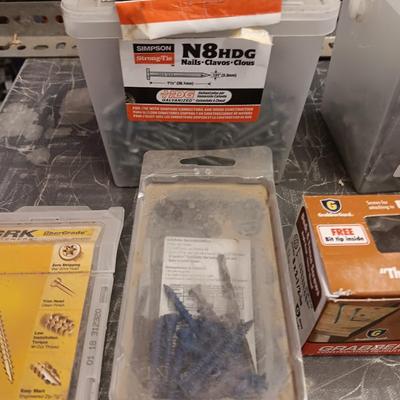 Assortment of hardware still in the boxes / tubs