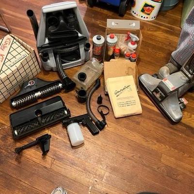 Bin of Kirby  Vacuum attachments, BAGS,  and accessories