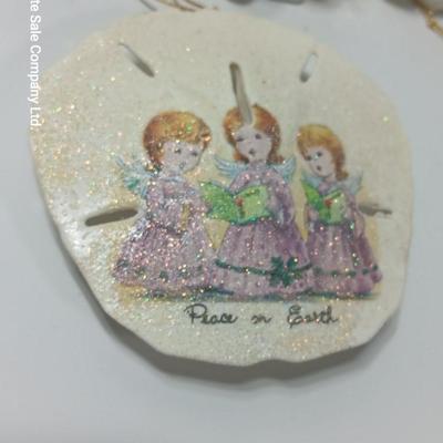 Collection of vintage Angels and a gold-colored oval platter.