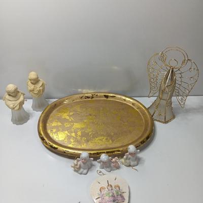 Collection of vintage Angels and a gold-colored oval platter.
