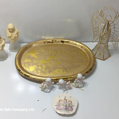 Collection of vintage Angels and a gold-colored oval platter.